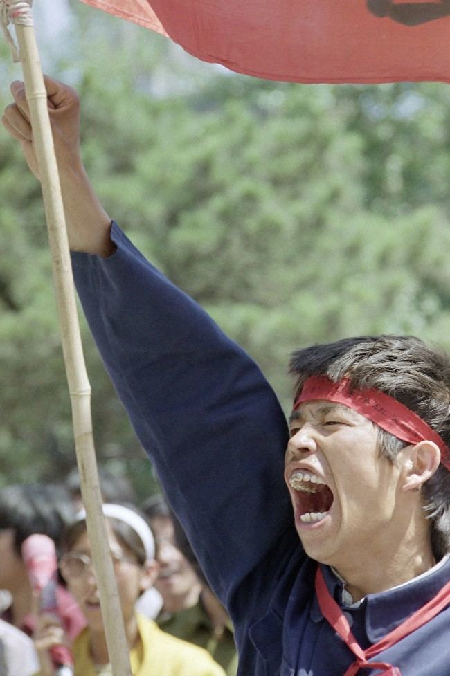 A Beijing University student sounds off during a rally, Thursday, May 25, 1989 in Beijing in Tiananmen Square. (AP Photo/Liu Heung Shing)