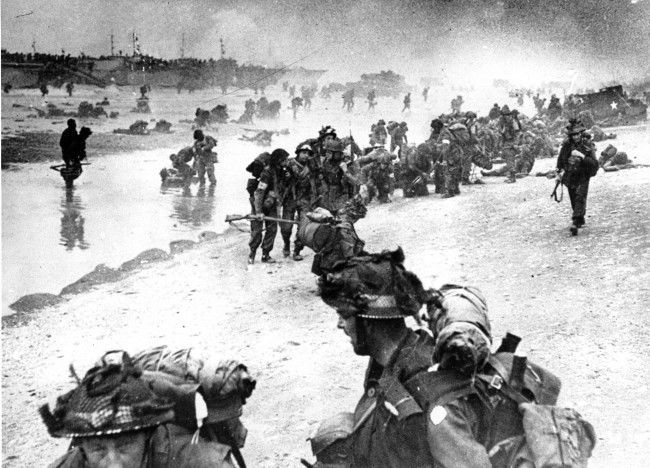 Wounded British troops from the South Lancashire and Middlesex regiments are being helped ashore at Sword Beach, June 6, 1944, during the D-Day invasion of German occupied France during World War II. (AP Photo)