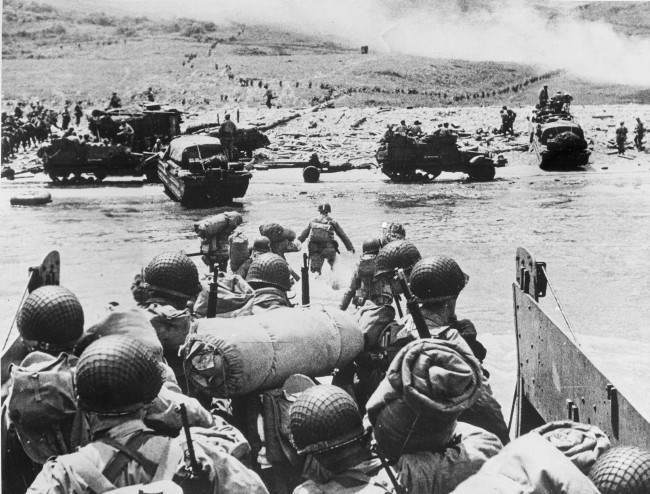American soldiers and supplies arrive on the shore of the French coast of German-occupied Normandy during the Allied D-Day invasion on June 6, 1944 in World War II. (AP Photo)