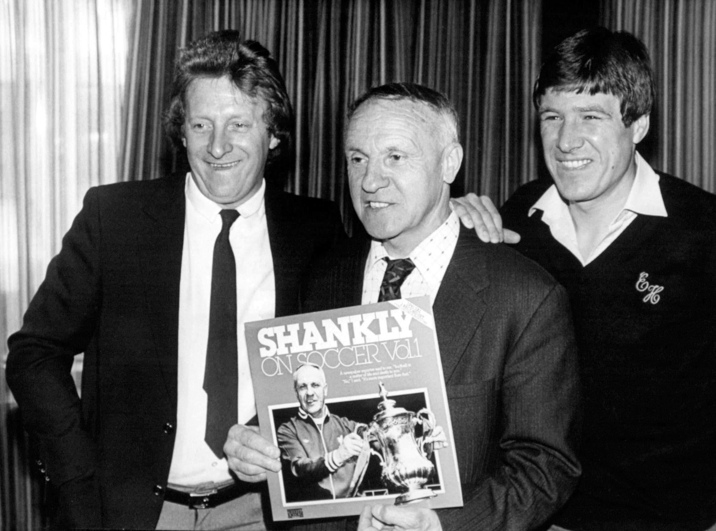Bill Shankly launches his first record with the help of Denis Law and Emlyn Hughes at the Press Club in London, 1981. He died five months later aged 68.