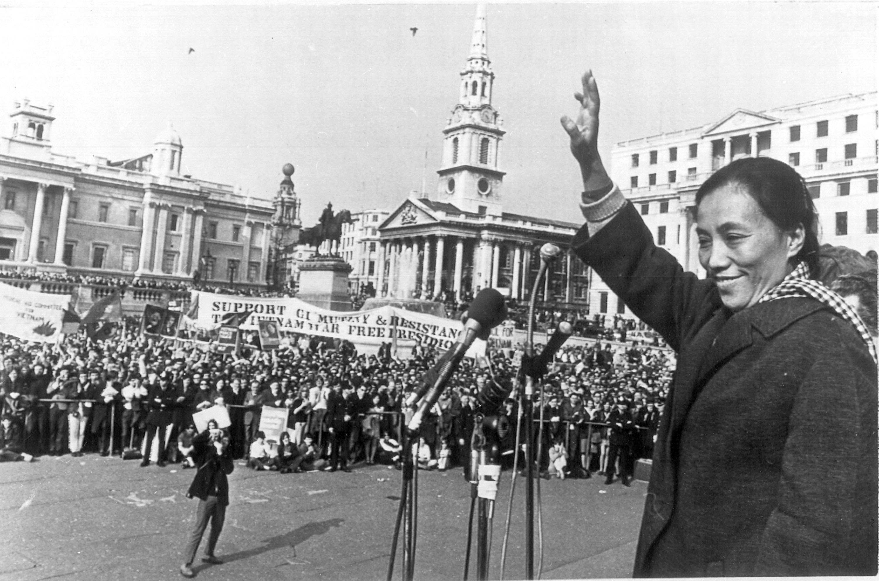 Madame Nguyen Thi Binh, deputy head of Vietnam's National Liberation Front delegation to the Paris peace talks, waves to the crowd gathered at London's Trafalgar Square, April 7, 1969. Several thousands of people attended the final stage of the annual Easter March from Cardiff to London, organized by the Campaign for Nuclear Disarmament, CND. Binh joined the march on the outskirts of London, accompanied by members of the British parliament. (AP Photo)