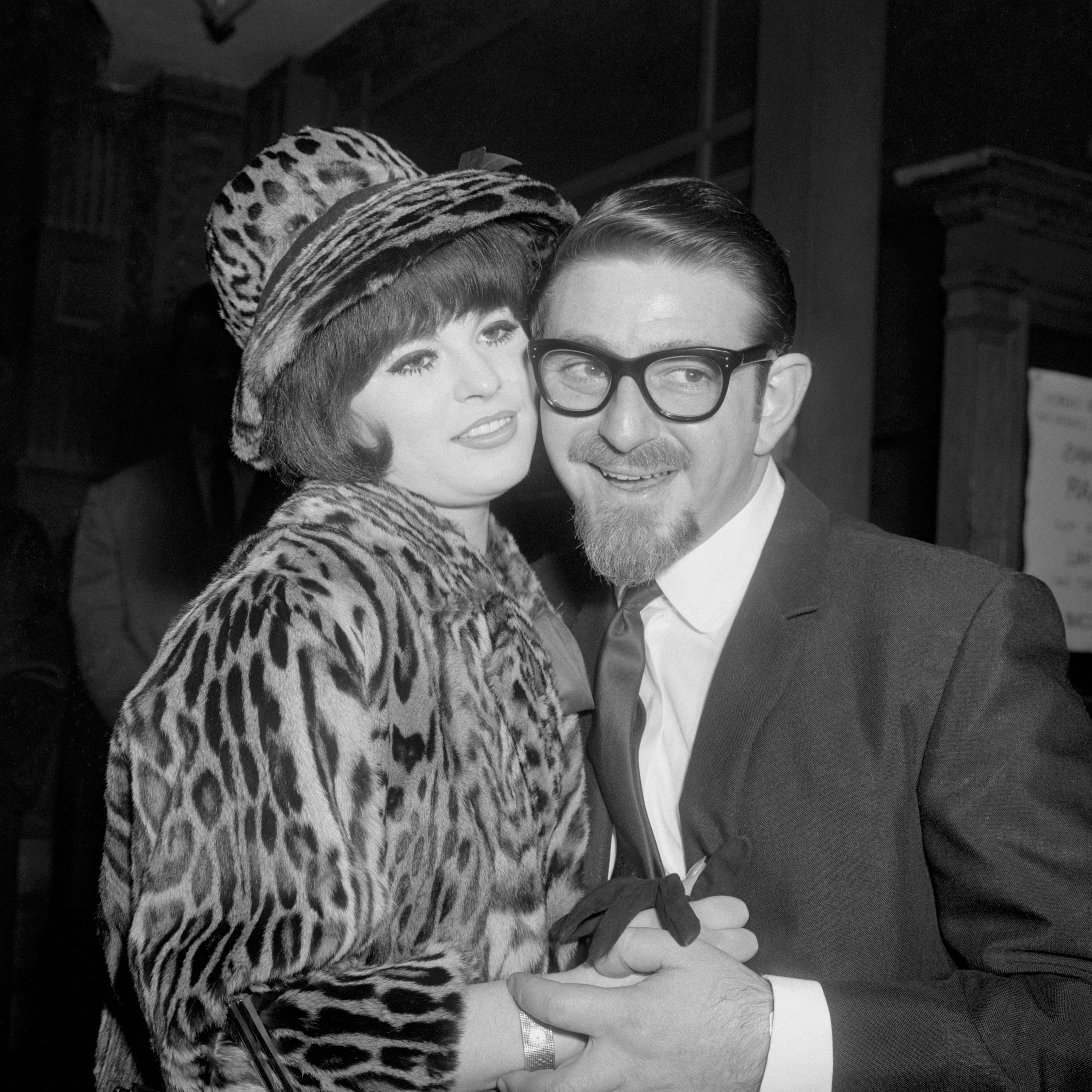 Glamour photographer Harrison Marks (r) with his bride, model Vivienne Warren (l), at Caxton Hall after their marriage on 30 November 1963.