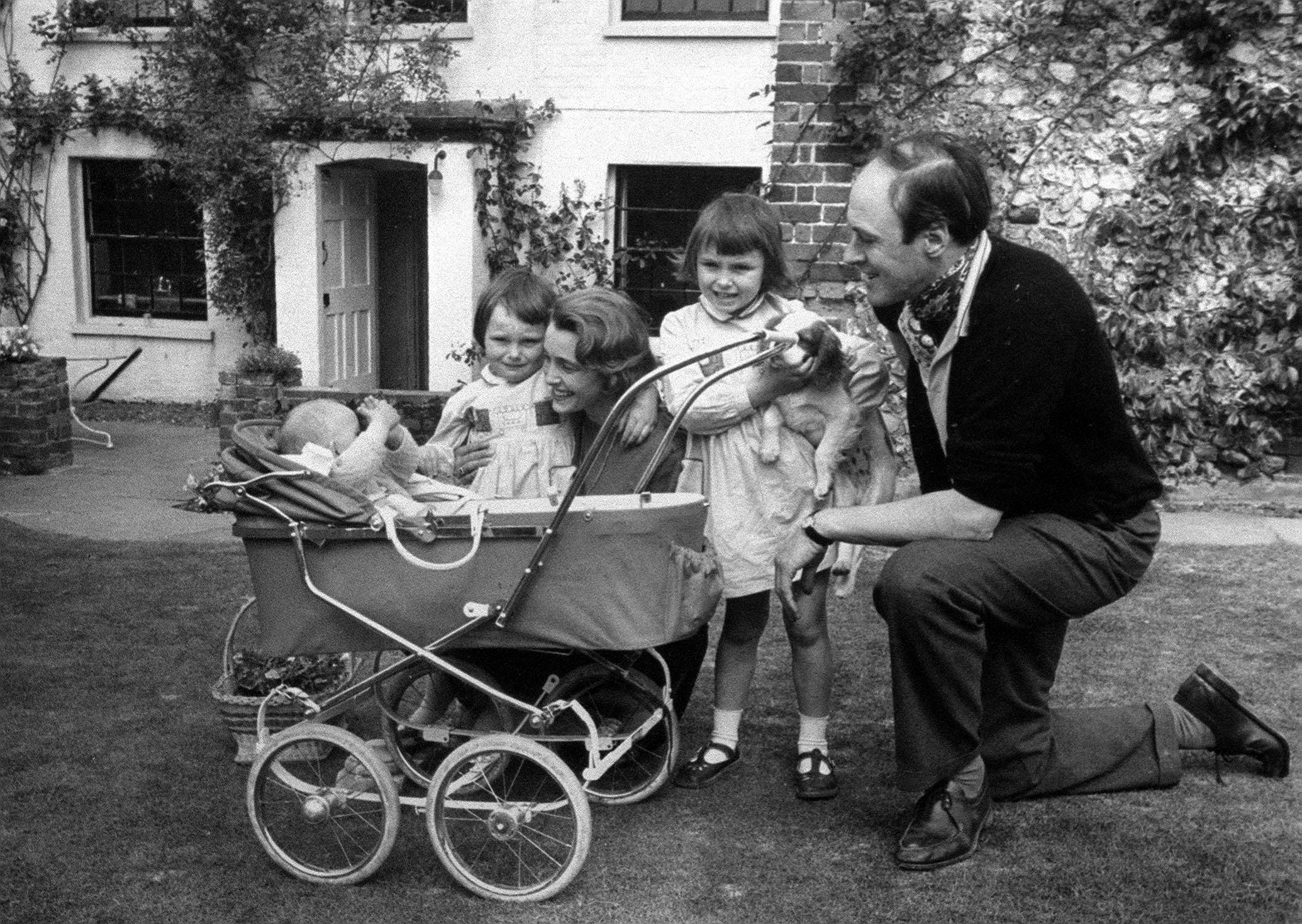 A family photograph of the children's author Roald Dahl, with his wife Patricia Neal, and children Olivia (right) Tessa, and Theo (in pram). 13th SEPTEMBER: Roald Dahl was born on this day in 1916. Ref #: PA.1172975 Date: 01/01/1961