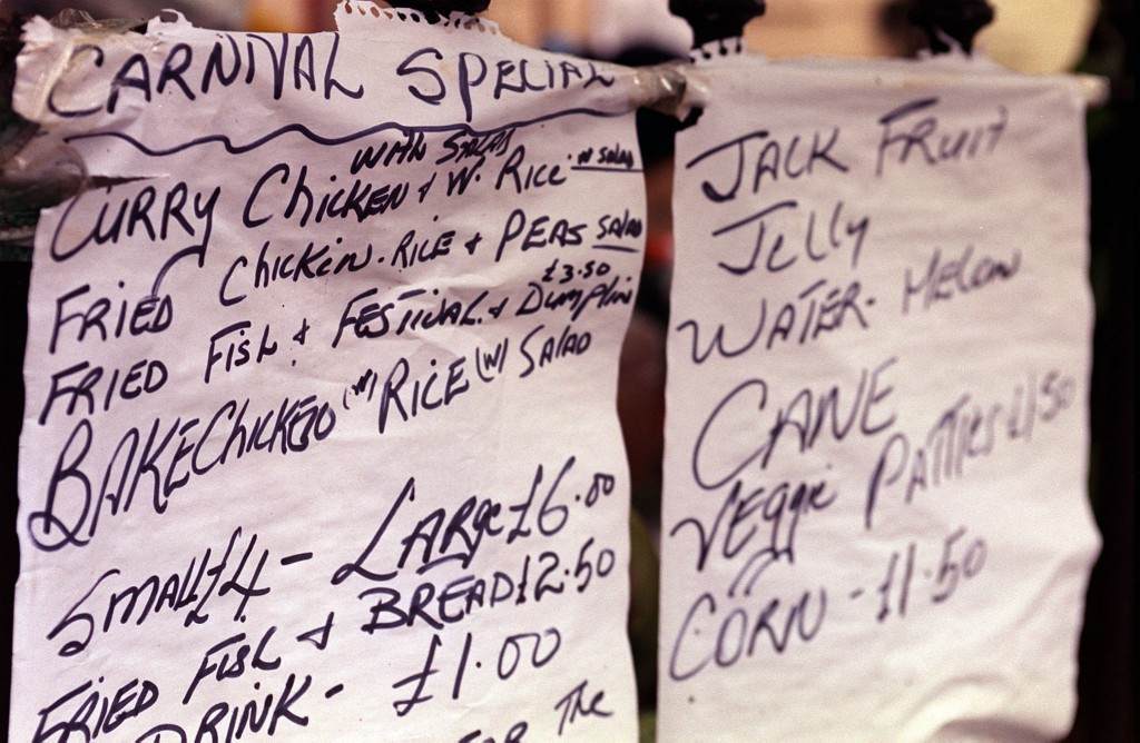 A menu of showing some of the food available at the Notting Hill Carnival 2000 in London. Ref #: PA.1335925  Date: 28/08/2000