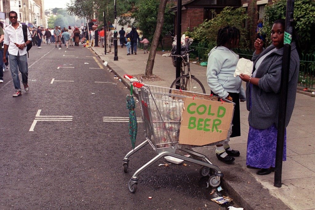 Women with a shopping trolley filled with cold beer at the Notting Hill Carnival 2000 in London. Ref #: PA.1335980  Date: 28/08/2000 