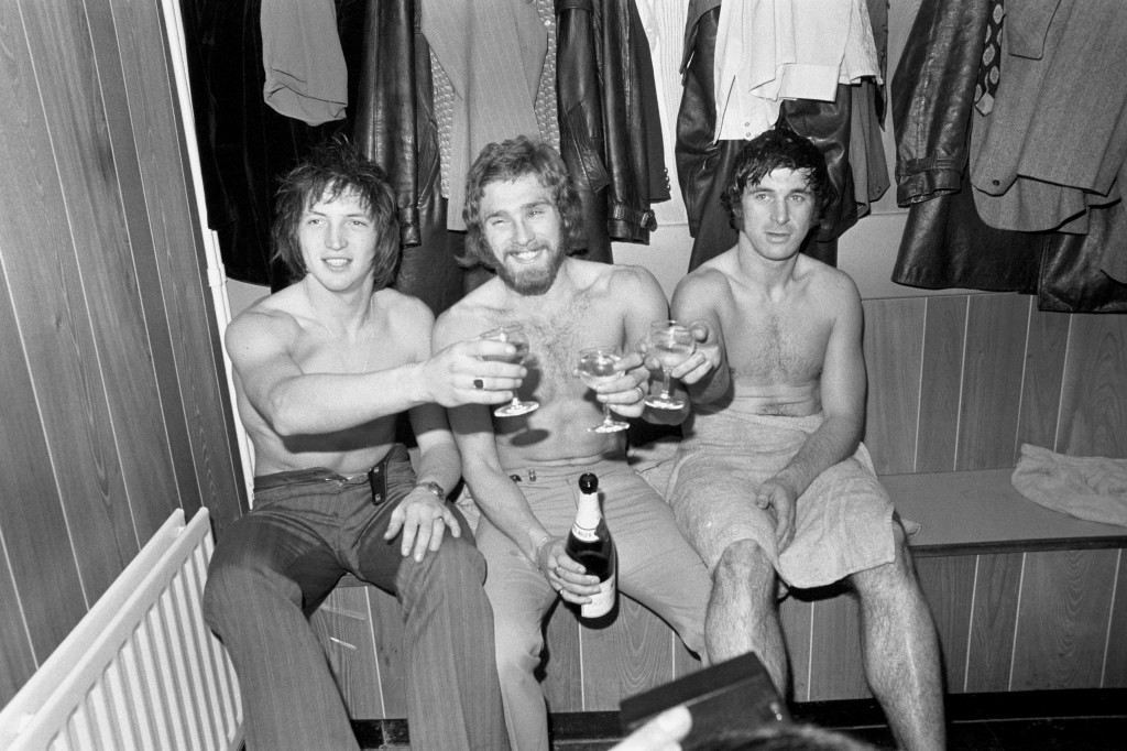Soccer - FA Cup - Fifth Round - Orient v Chelsea - Brisbane Road (L-R) Orient's goalscorers Phil Hoadley, Barrie Fairbrother and Mickey Bullock celebrate victory with a glass of champagne in the dressing room after the match Ref #: PA.2939524  Date: 26/02/1972