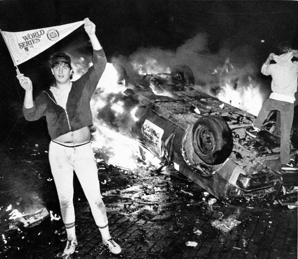 Bubba Helms stands next to a burning Detroit police car after the Detroit Tigers beat the San Diego Padres to win the 1984 World Series in Detroit. Helms became a folk hero of sorts; two weeks after the Tigers won, a number of people came to Detroit-area Halloween parties dressed like him. The rest of his life, though, would be marked by failure, drug addiction, mental illness and a broken marriage. (AP Photo/Joe Kennedy) Ref #: PA.8652868  Date: 01/01/1984