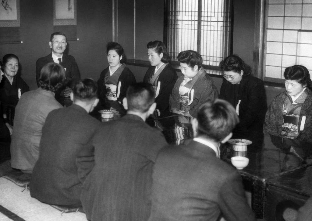 Eight girls and four men met with matrimony as the object at the Myogetsu-En, behind the Ueno Art Museum in Tokyo on Sunday, Jan. 28, 1947. The go-between the marriage interview was the Nippon (Japan) Eugenic Marriage Association which declared it has an overwhelming number of women than men on its waiting list. (AP Photo) Ref #: PA.11460510 