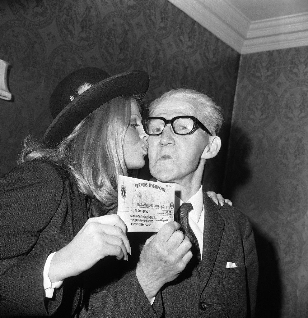 A kiss from Swedish actress Britt Ekland for Mr. Nile Sandberg, of Sweden, after she had presented him with a check for Â£119,000, at a reception in London, United Kingdom on Oct. 21, 1971, following Mr. SandbergÂs win on Vernons Treble Chance Pool. Finding Mr. Sandberg, to give him the good news, proved to be quite a job. The VernonÂs representative had to travel to a coastal village in Southern Sweden, in his search for the 75-year-old widower....only to find he was away on holiday. Mr. Sandberg was finally tracked down to Copenhagen, whore he was visiting a niece. (AP Photo/Leonard Brown) Ref #: PA.11721246  Date: 21/10/1971 