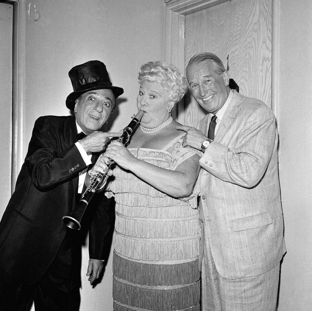Ted Lewis and Sophie Tucker, who are appearing as co-headliners at the Moulin Rouge in Hollywood are visited by entertainer Maurice Chevalier, right, backstage, Aug. 13, 1959. (AP Photo) Ref #: PA.12578151 