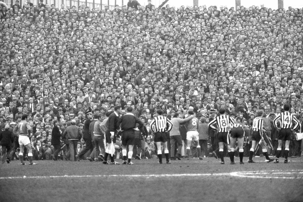 Soccer - Inter-Cities Fairs Cup - Semi-Final 2nd Leg - Newcastle United v Rangers - St James' Park Some members of the crowd are seen on the pitch following an incident between Newcastle's Davies and Rangers' McKinnon. Twenty-two people were taken to hospital with injuries after fighting broke out on the field. Ref #: PA.18756907  Date: 21/05/1969