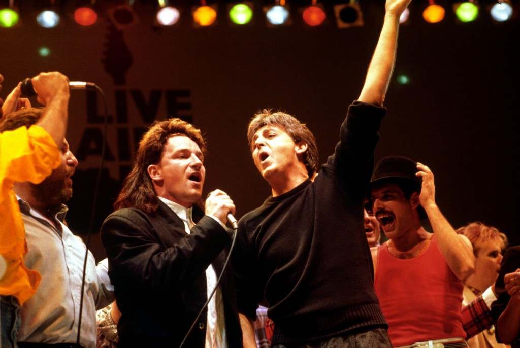 Left to right: Bono of U2, Paul McCartney, and Freddy Mercury of Queen, during the finale. PA-2328106