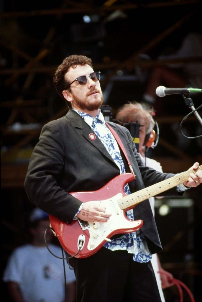 Elvis Costello performing on stage. Elvis Costello performing on stage.