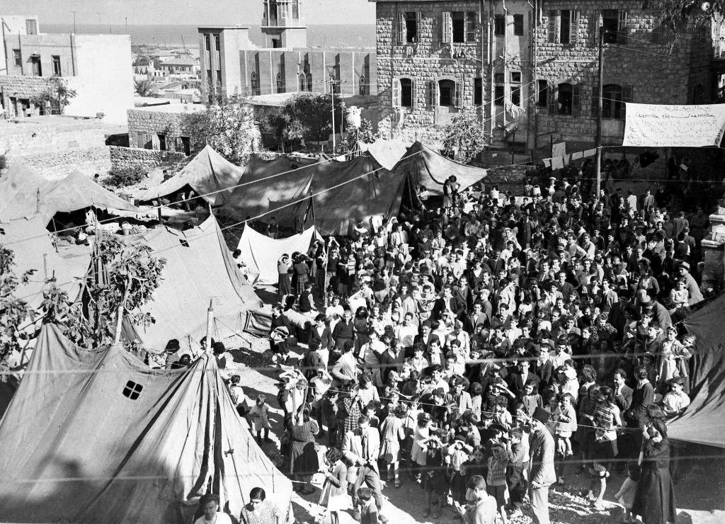 Some of the thirteen hundred Palestinian Armenian from Jaffa, Jerusalem and Haifa, in the tent camp in the grounds of the Armenian Church, Haifa, Oct. 29, 1947, where they are waiting for transport to Soviet Armenia. (AP Photo/Pringle) Ref #: PA.5737212 Date: 29/10/1947 