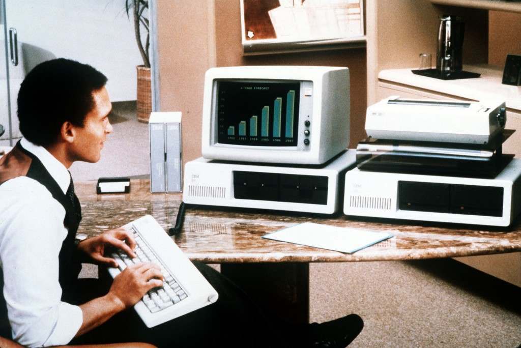 IBM Personal Computer - A man tries out the enhanced version of International Business Machines Corp's Personal Computer which was unveild in New York, March 8, 1983. IBM also introduced several other related products including devices that boost the memory of its existing machine, a color display terminal and new software, or programs, to run both the personal computer and the new model. (AP-Photo)