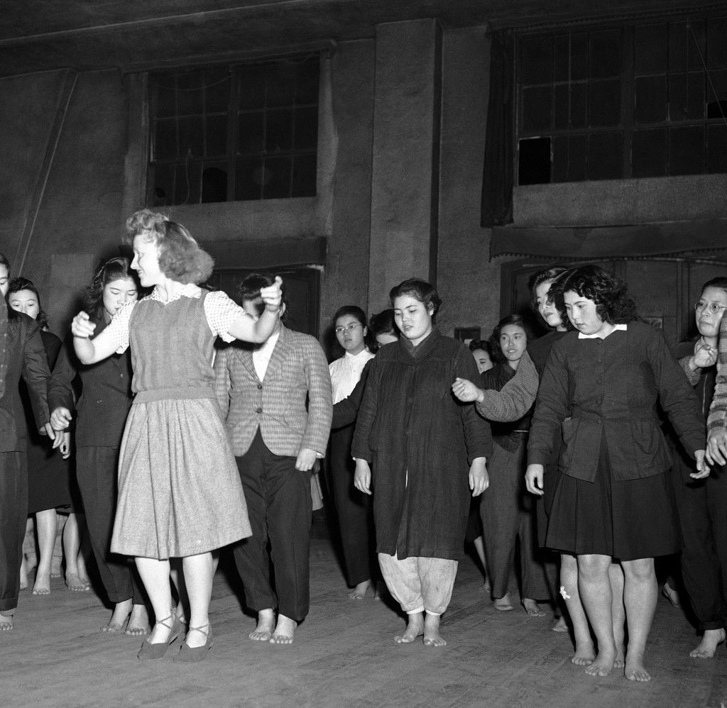 Barbara McBride teaches Russian-style Korobotchka dance to her Japanese students in Tokyo at the YWCA, once a week as seen here, Dec. 29, 1946. (AP Photo) Ref #: PA.7641875 