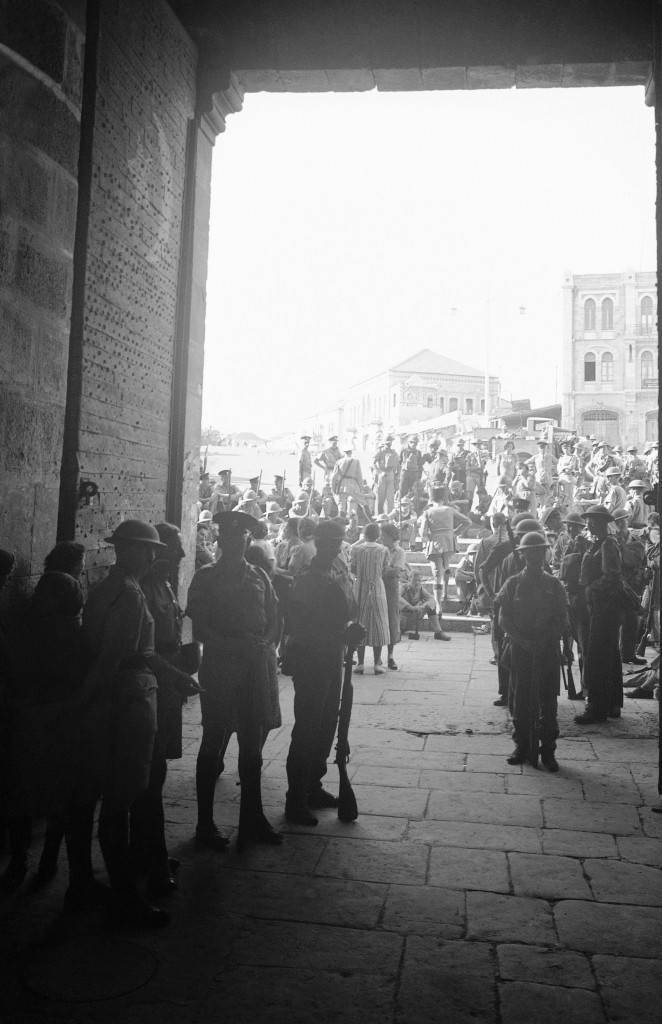 British soldiers in steel helmets after they recaptured the Old City of Jerusalem at the Damascus Gate, November 1938. (AP Photo/James Mills) Ref #: PA.8988943 Date: 01/11/1938