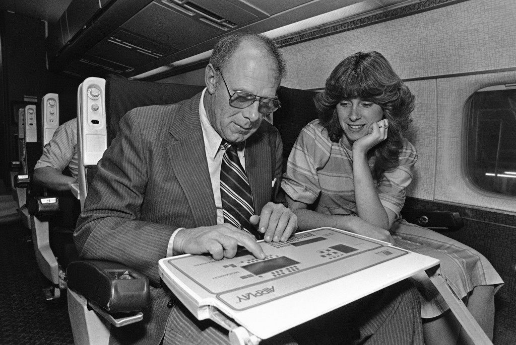 Untied Airlines employees try their luck at one of the computer games being installed in one of UnitedÂs jets in their San Francisco maintenance facilities on June 8, 1984. The computers embedded in the tray table attached to the seat backs facing the passenger feature video backgammon, checkers, blackjack poker and soccer. Unlike the casinos, however, the on-board games are free and silent. (AP Photo/Mark Costantini)