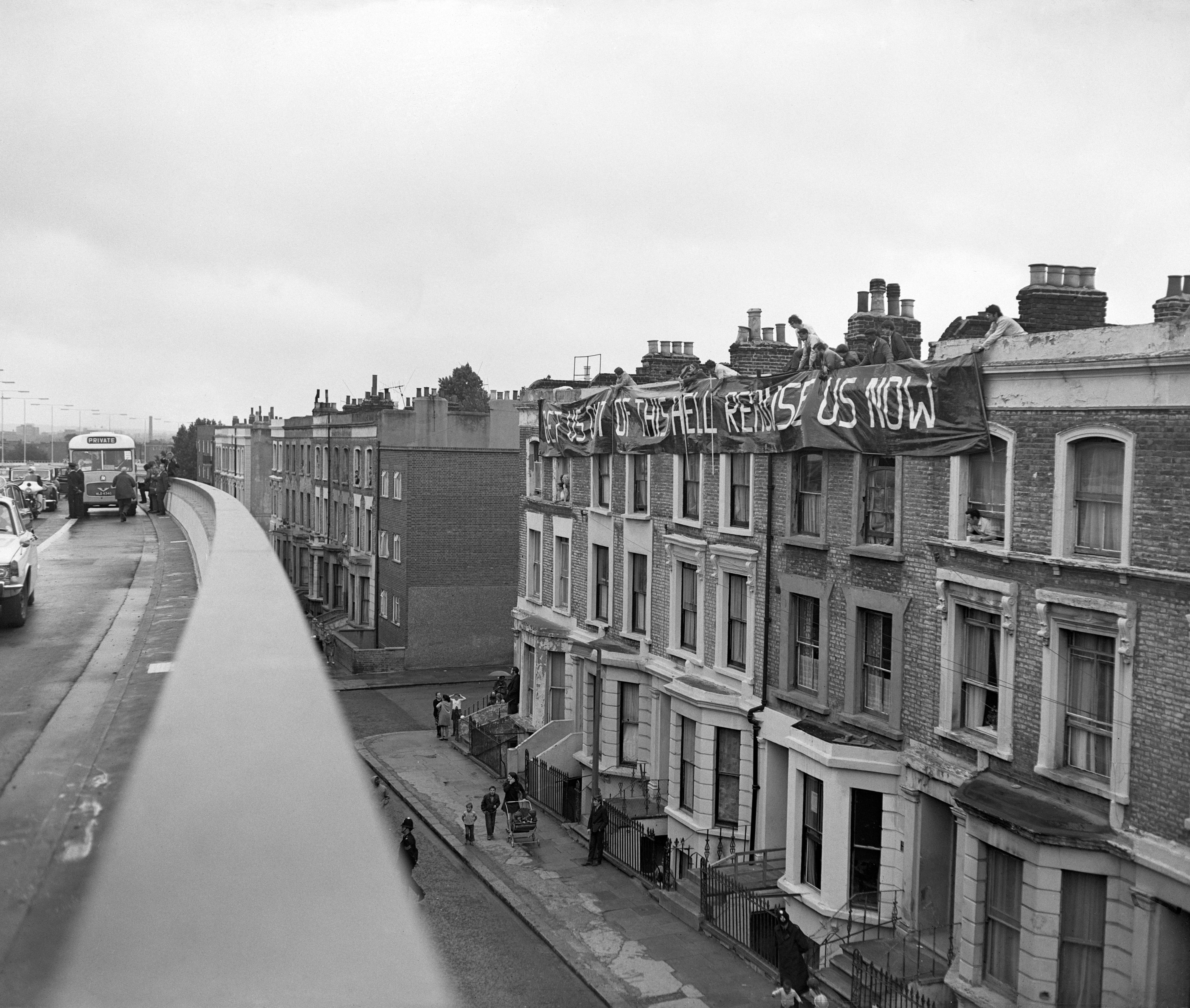 Flats in the Achlam Road section of the Western Avenue Extension are decorated with banners put up by residents, protesting against the new road, on the day of the opening ceremony at Paddington Green. The 2.5 mile long 'Westway', Britain's longest elevated road, is a section of the A40 route in west London and runs from Paddington to North Kensington. It was built to relieve congestion at Shepherd's Bush caused by traffic from Western Avenue.