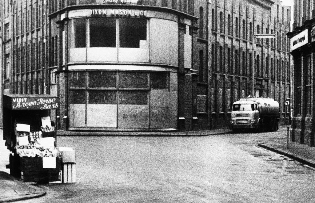 Belfast city center is cleared on Feb. 3, 1973, so that British Army bomb disposal experts could de-fuse a bomb placed on this tanker, at right, containing 4,000 gallons of petrol. The bomb was safely made harmless and life returned to what is normal for Belfast, Northern Ireland. (AP Photo) Ref #: PA.10778618 
