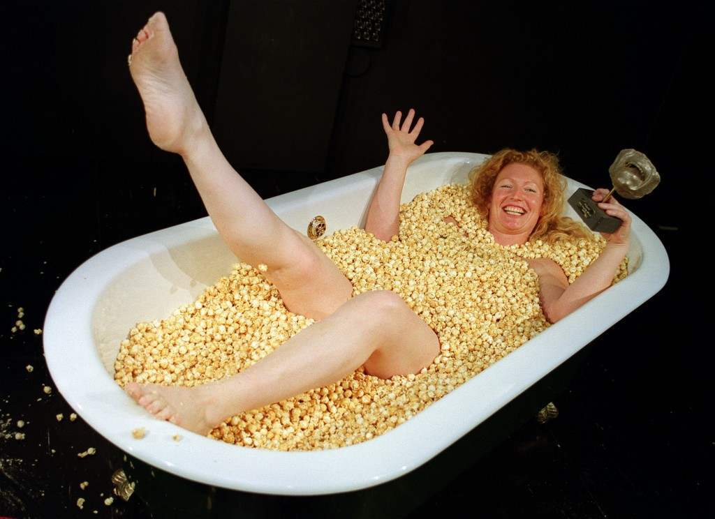 CHARLIE DIMMOCK IN BATH OF POPCORN