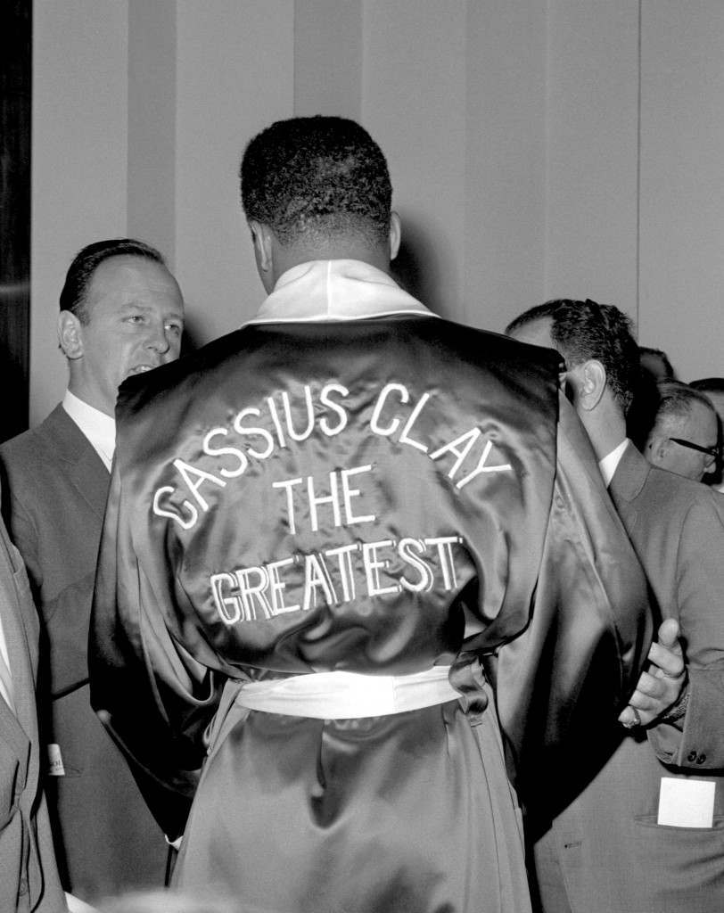 Cassius Clay at the weigh-in for his fight with British heavyweight Henry Cooper at the London Palladium. 