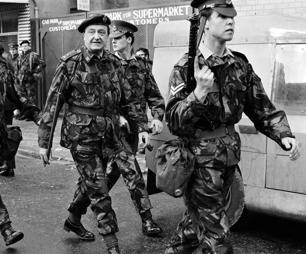 Lieut. General Sir Harry Tuzo, GOC Northern Ireland, (centre) with a Military Police escort in Newry. Ref #: PA.1703356 Date: 06/02/1972