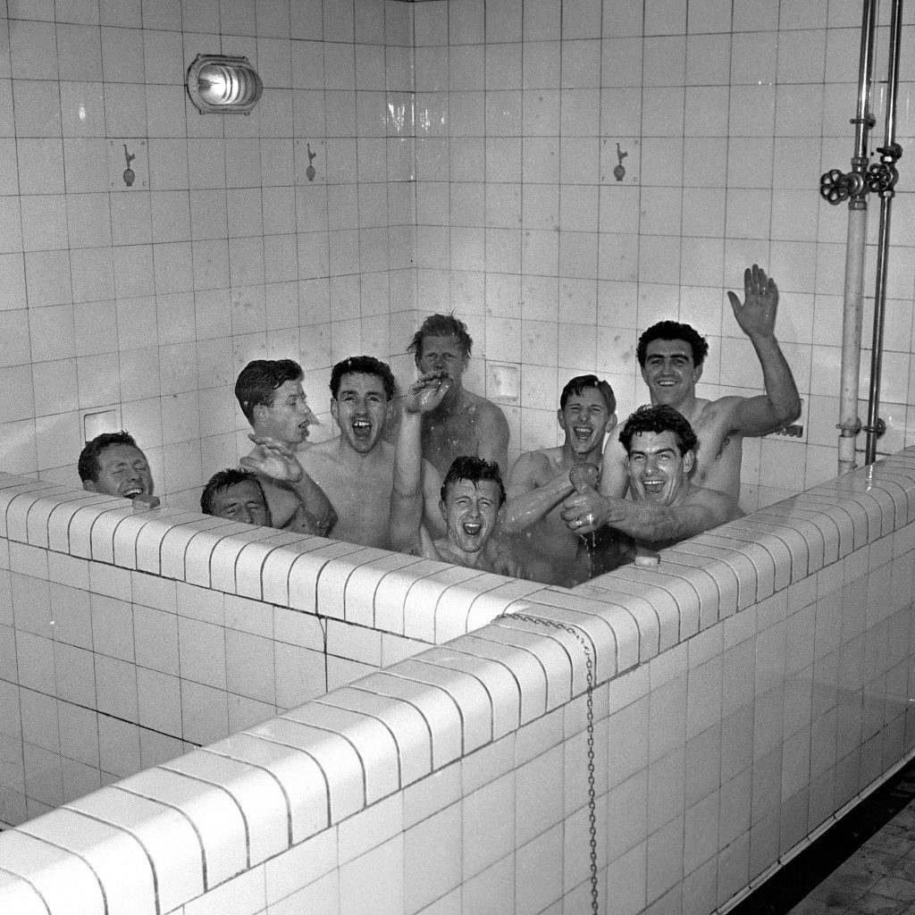 After winning the League championship following a victory over Sheffield Wednesday, members of Tottenham Hotspur took to a warm bath. From left to right: Les Allen, Cliff Jones, John White, Dave Mackay, Peter Baker (rear); Terry Dyson, Bill Brown, Ron Henry and Bobby Smith (rear waving). Two absent members were captain Danny Blanchflower who took a shower, and Maurice Norman who was having a cut head stitched. Ref #: PA.4875397  Date: 17/04/1961