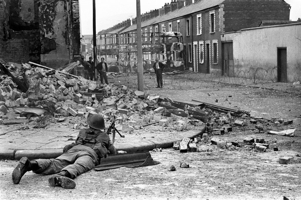 A British Army soldier on lookout in the Falls Road area of Belfast. Ref #: PA.4893379 Date: 15/08/1969