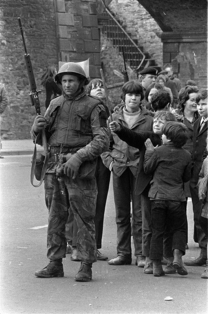 Local children taunt and play with a British soldier as he stands guard in Londonderry, Northern Ireland, April 13, 1972, following an explosion in the city. (AP Photo/Michel Lipchitz) Ref #: PA.8671020 