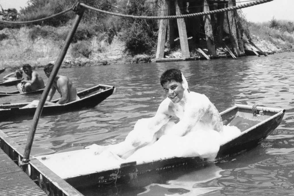 A Pontoon supporting of foot bridge near Da nang Republic of Vietnam on April 29, 1966 serves as a bathtub for Sgt. Richard Mccloud (Aiea, Hawall) for ÂGÂ Co.,2nd Bn., ninth Marine Regiment, 3rd Marine Division. The Bubble bath was sent by a girl friend. The Bridge links the company's positions. (AP Photo)