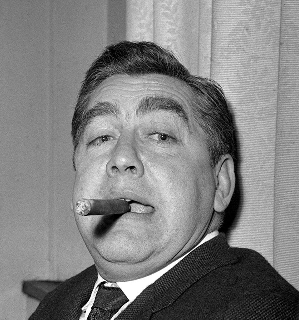 With the cigar approved by all tycoons, comedian Tony Hancock presents a new face to the world - as head of his own production company. Ref #: PA.1659902  Date: 22/01/1962