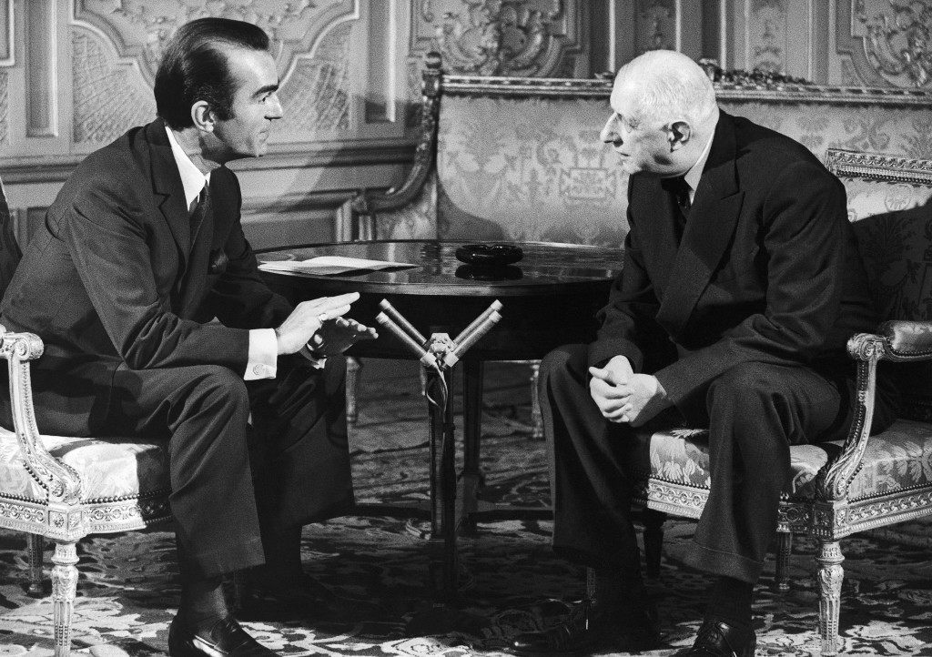 French journalist Michel Droit, left, interviews Gen. Charles de Gaulle on April 10, 1969, in Paris, France. (AP Photo/Michel Lipchitz)