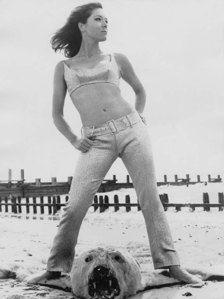 English actress Diana Rigg , models an ice-blue lame trouser suit from the upcoming 'The Avengers' episode 'Castle De'Ath', 29th September 1965. Jean Varon sells the outfit for 29 guineas, Diana Rigg, Diana Rigg sexy