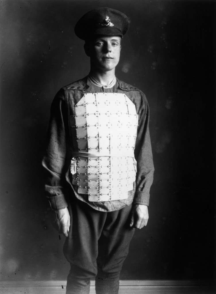 circa 1914: A soldier wear body armour made of linked steel plates covering his chest and abdomen. (Photo by Central Press/Getty Images)