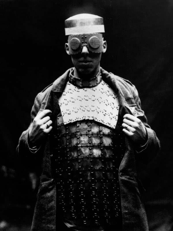 1918 American soldier trying on captured German body armor.