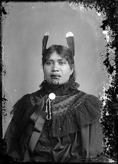 Unidentified Maori woman with a chin moko, feathers in her hair, and European clothing, [ca 1895] Reference Number: 1/2-012406-G Unidentified Maori woman, circa 1885, with a chin moko and feathers in her hair. She wears European style clothing. Location and photographer unknown. Key terms: 1 image, categorised under Portraits and Dry plate photonegatives, related to Women, Maori - Moko and Maori - Clothing. Part of: Unidentified Maori woman with a chin moko, feathers in her hair, and European clothing, Reference Number 1/2-012406-G (1 digitised items) Extent: 1 b&w original negative(s)Dry plate glass negative. Single negative Conditions governing access to original: Not restricted Other copies available: File print available in Turnbull Library Pictures572. Maori. Tattooing. Women(PFP-022595) Usage: You can search, browse, print and download items from this website for research and personal study. You are welcome to reproduce the above image(s) on your blog or another website, but please maintain the integrity of the image (i.e. don't crop, recolour or overprint it), reproduce the image's caption information and link back to here (http://mp.natlib.govt.nz/detail/?id=25950). 