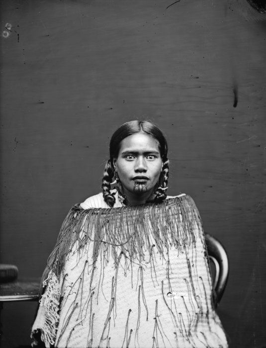 Carte de visite portrait of a Maori woman wearing a korowai (tag cloak), probably associated with the Pai Marire party who executed Carl Sylvius Volkner at Opotiki in 1864, taken in the 1870s by Samuel Carnell of Napier.