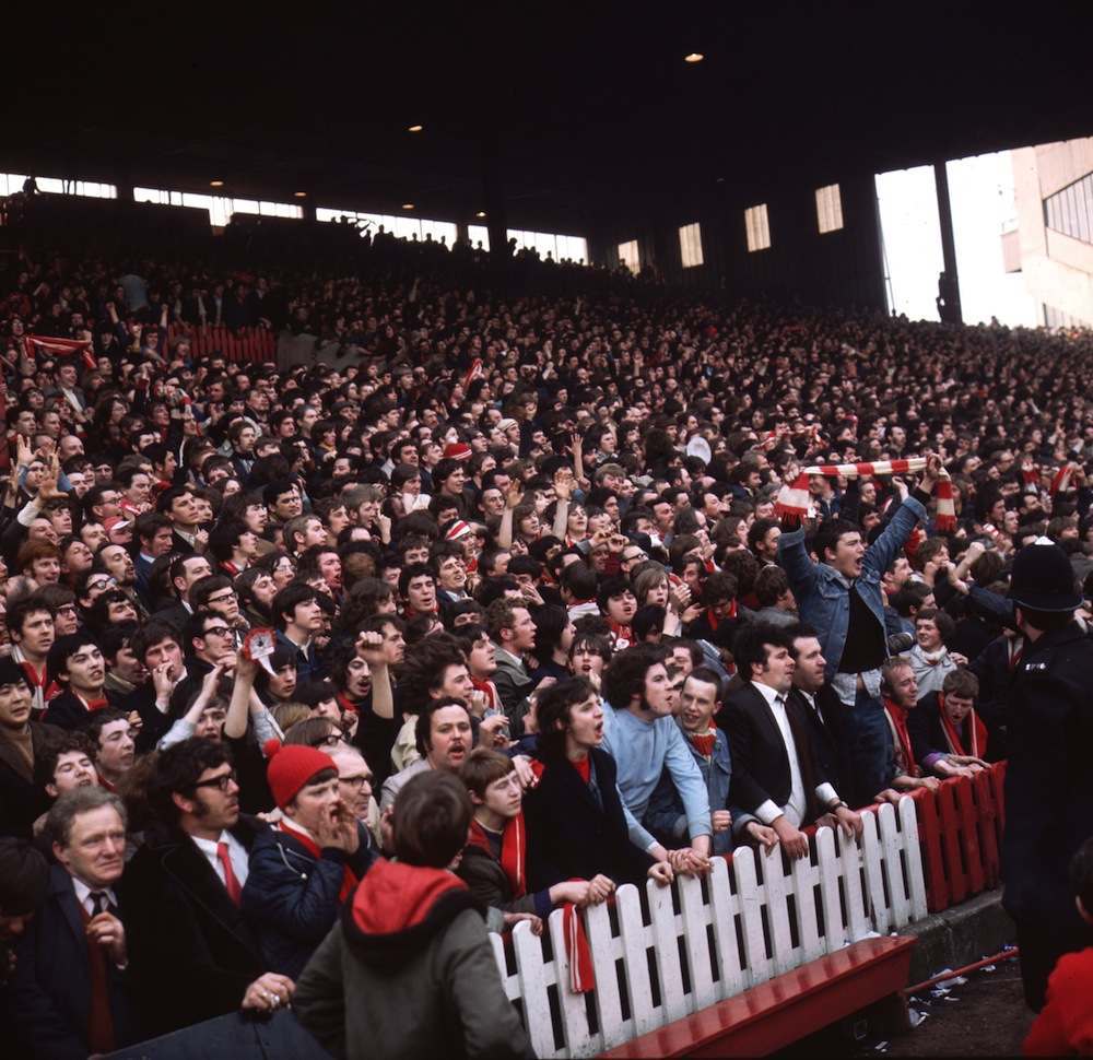 1971:  Supporters of Liverpool FC on the terraces during a semi-final match against Everton in the FA cup.  (Photo by Aubrey Hart/Express/Getty Images)