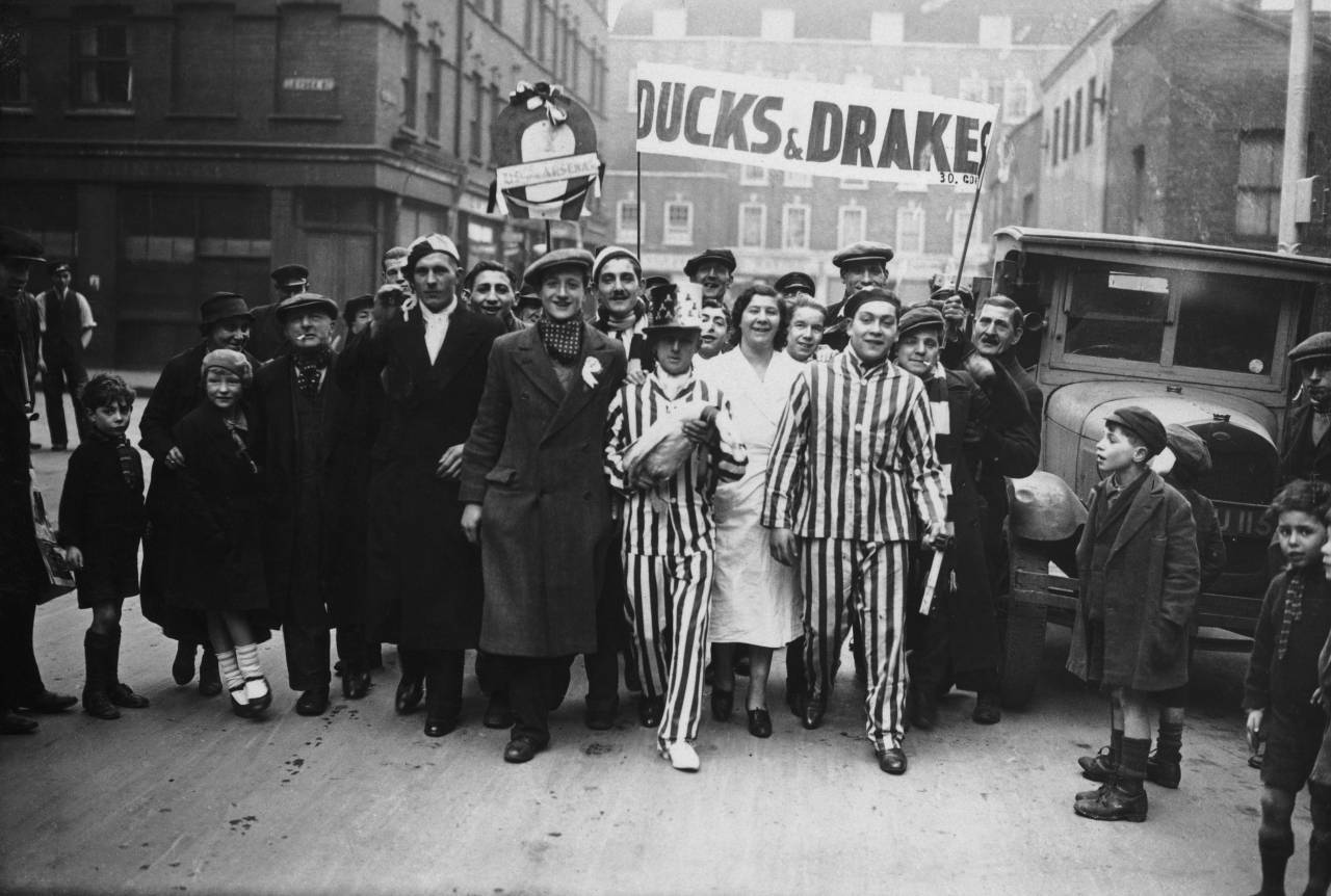 Arsenal fans, holding their duck mascot, leaving London to travel to Reading for the FA Cup tie, 16th February 1935 (Photo by J. A. Hampton/Topical Press Agency/Getty Images)