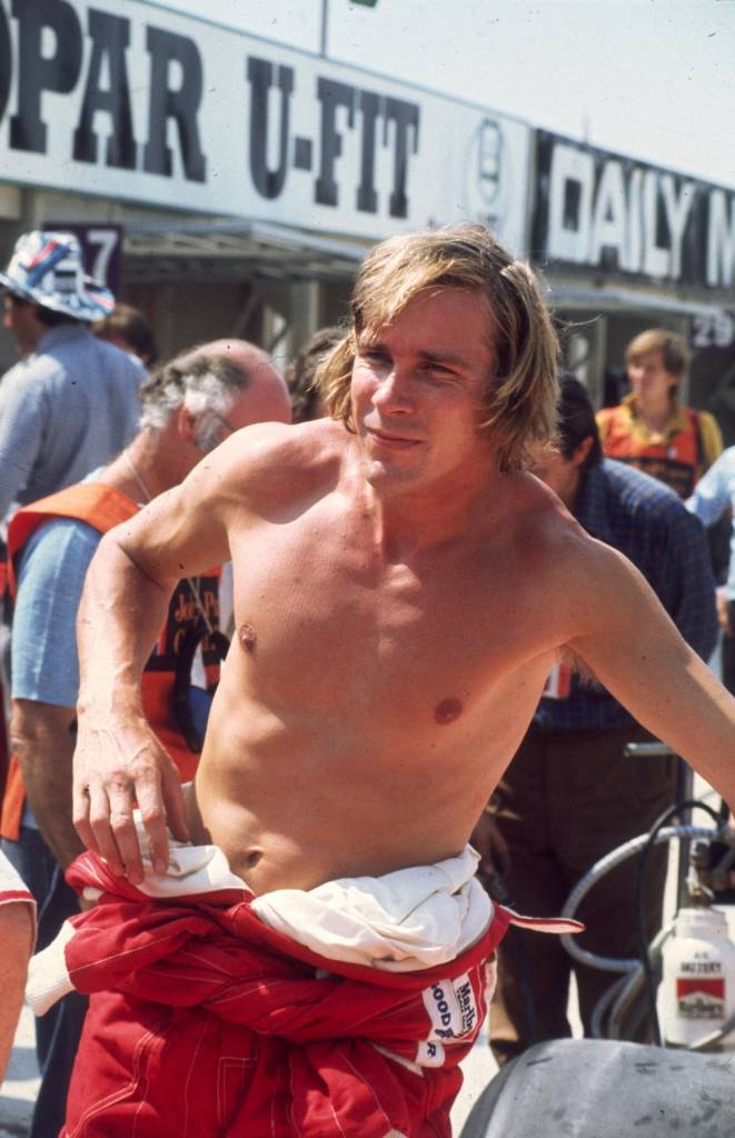 18th July 1976: Formula 1 racing driver James Hunt (1947 - 1993) with his overalls pushed down to his waist at the Brands Hatch British Grand Prix. (Photo by Keystone/Getty Images)