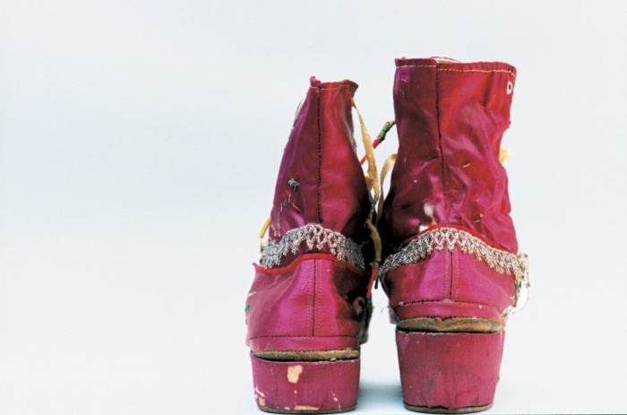 Kahlo’s fringed boots, the right one with a stacked heel