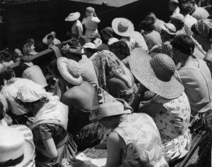 29th June 1957: Spectators shading themselves from the sun at the Wimbledon tennis tournament, during a heatwave in London. (Photo by Keystone/Getty Images)