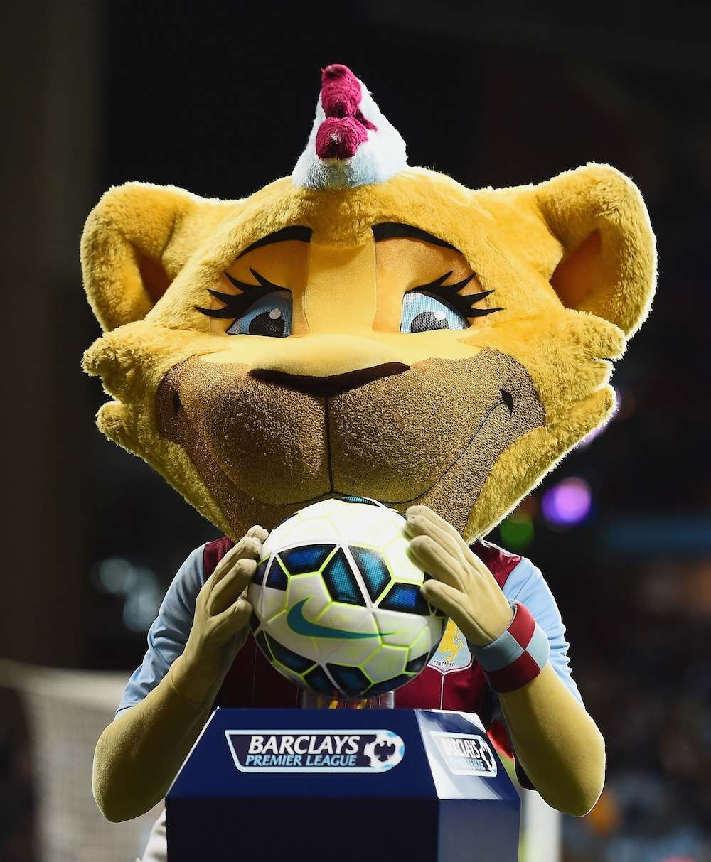 BIRMINGHAM, ENGLAND - MARCH 03: Villa mascot Bella the Lion holds the Nike matchball prior to the Barclays Premier League match between Aston Villa and West Bromwich Albion at Villa Park on March 3, 2015 in Birmingham, England. (Photo by Laurence Griffiths/Getty Images)