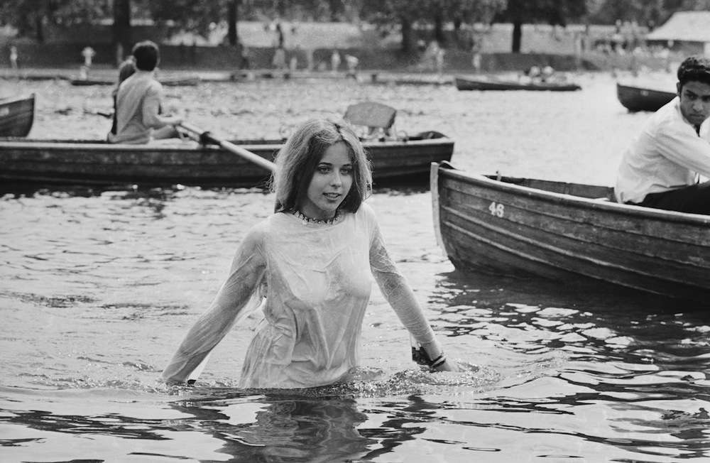 A teenage girl cooling off in the Serpentine during the Rolling Stones concert in Hyde Park, London, 5th July 1969. (Photo by Reg Burkett/Express/Getty Images)