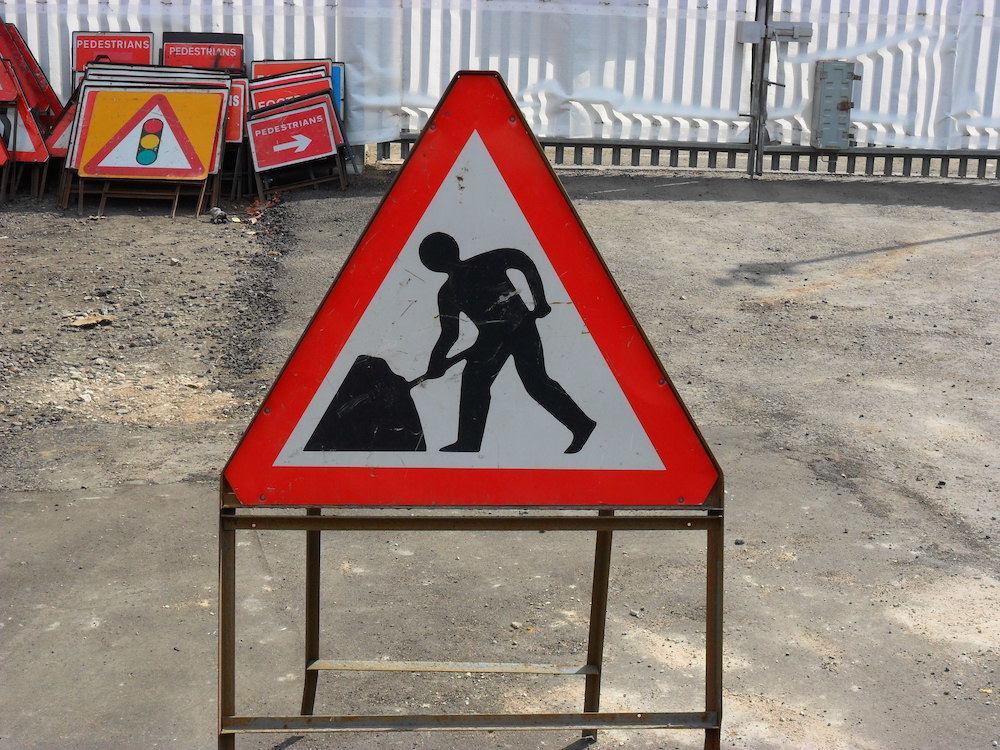 men at work road sign