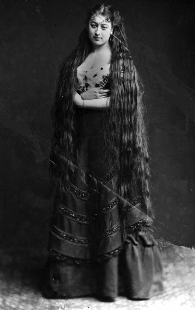 circa 1890:  Mrs Frampton proudly displays her very long hair.  (Photo by Hulton Archive/Getty Images)