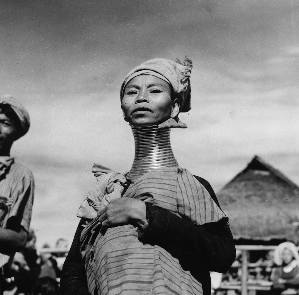 circa 1950:  A Padaung, or Kayan woman. Originally a Mongolian tribe, the Padaung have been assimilated into the Karen group native to Mayanmar (Burma). The most stiking feature of these people are the brass rings fitted to the necks and limbs of women born on Wednesdays. The first neck ring is fitted when they are five or six, with successive rings fitted every two years, denoting the status of their family.  (Photo by Vitold de Golish/Three Lions/Getty Images)