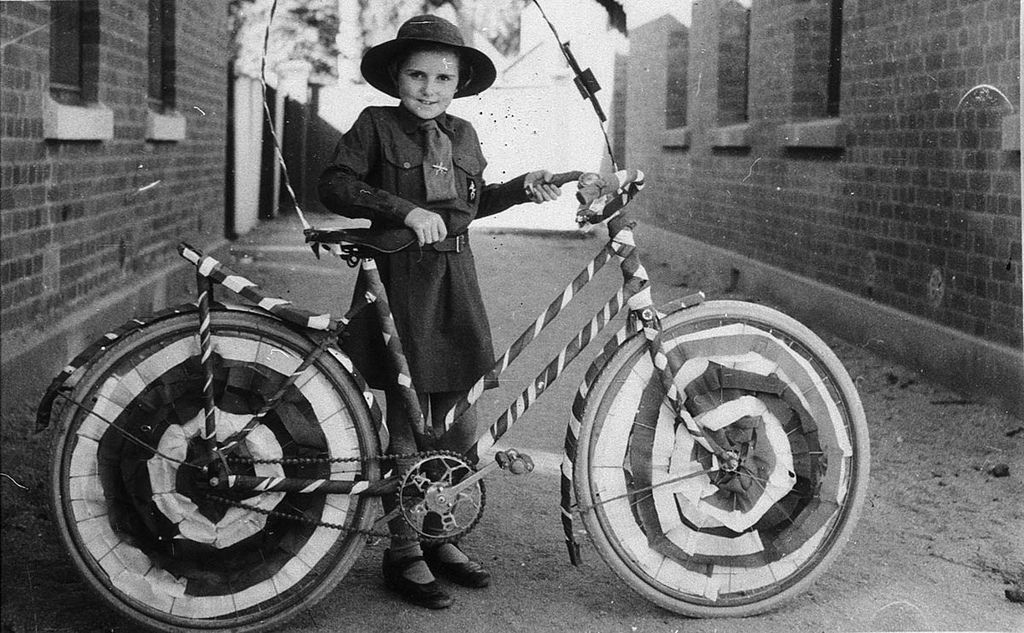 Brownie (Muriel Long) with bicycle decorated for street procession - Deniliquin, NSW, n.d.