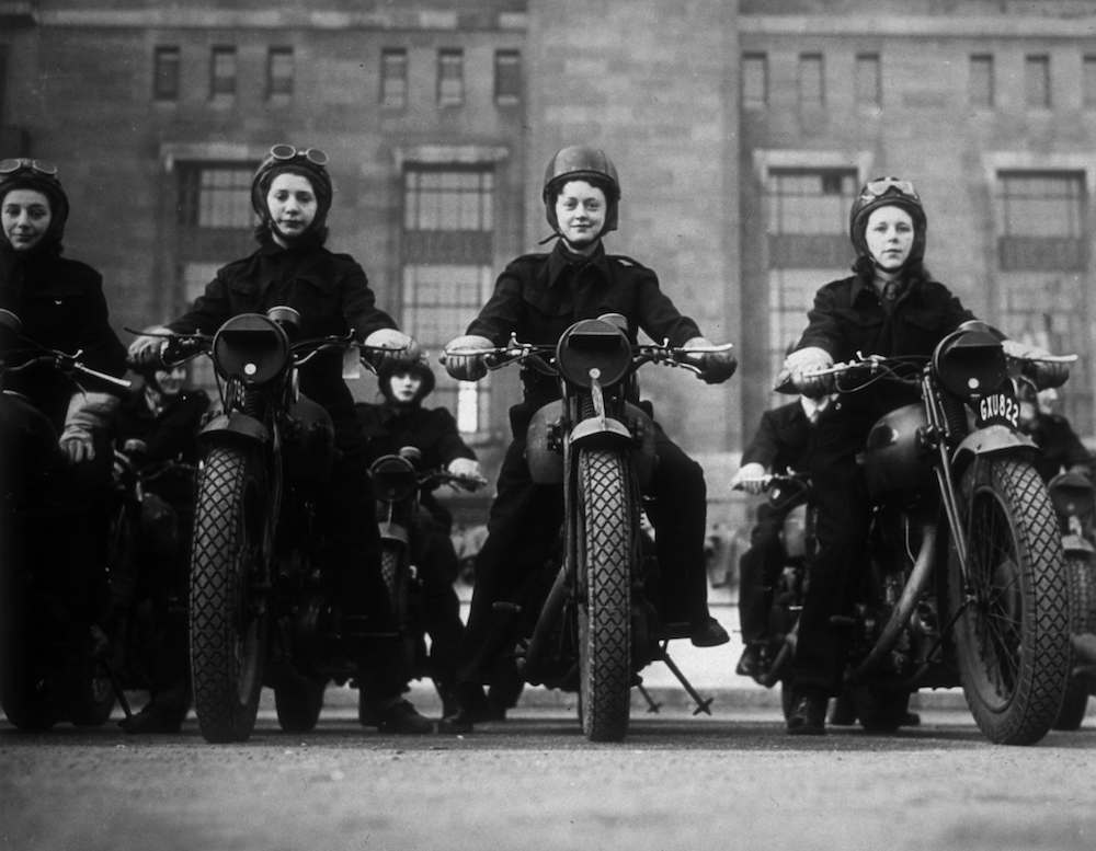 circa 1940:  Ministry of Information dispatch riders on their motorbikes.  (Photo by Fox Photos/Getty Images)